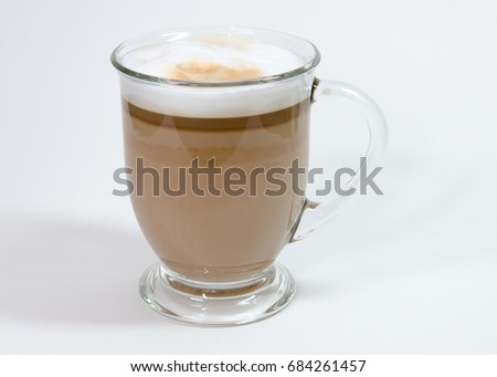 Latte in clear glass with foam Royalty-Free Stock Photo #684261457