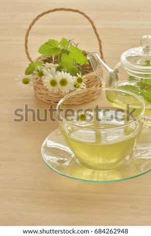 Herb tea on a wood background
