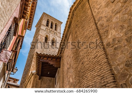 Mudejar tower of the Iglesia de Santo Tome in the Historic City of Toledo. The Historic City of Toledo is a UNESCO World Heritage Site. Royalty-Free Stock Photo #684265900