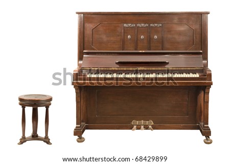 Old upright german piano and a stool isolated over white background. Both clipping paths are included. Royalty-Free Stock Photo #68429899