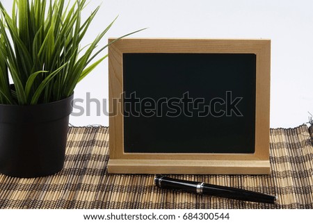 Chalkboard and green plant.