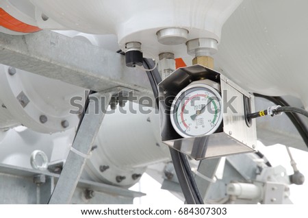 Close up of barometer mounted on industrial device 
