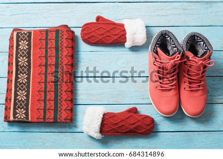 winter clothes and shoes on a wooden background