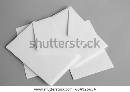 Blank portrait A4. blank realistic envelopes mockup on gray, changeable background / white paper isolated on gray
