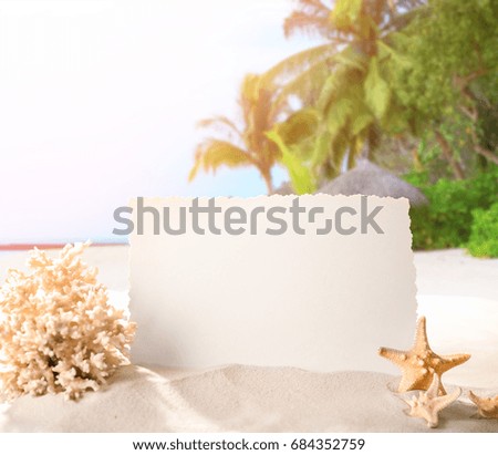 Blank card with marine decor on beach. Summer vacation concept