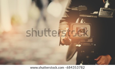 man with video camera Royalty-Free Stock Photo #684353782