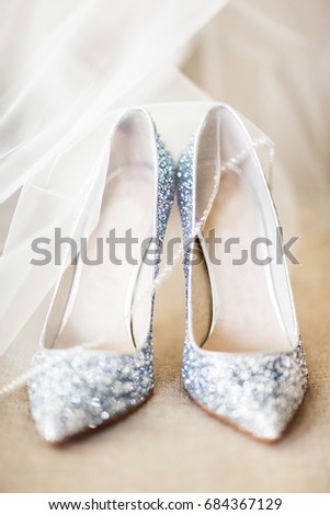 Wedding shoes and veil on the floor. Royalty-Free Stock Photo #684367129