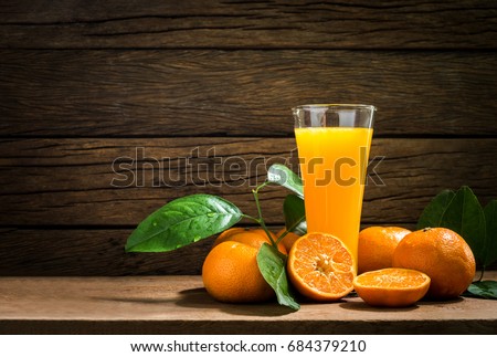 Still Life Glass of Fresh Orange Juice on Vintage Wood Table with Copy Space Background Royalty-Free Stock Photo #684379210