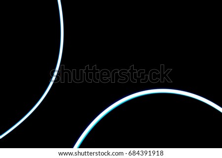The abstract photo showing of the mystery blue line light, or flashlight path arts patterns for texture and business background isolated on black template with blank space