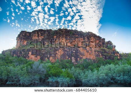 The Hunter River Estuary. Huge sandstone cliffs surround the landscape mixed in with mangrove wetlands. Kimberley, Australia Royalty-Free Stock Photo #684405610