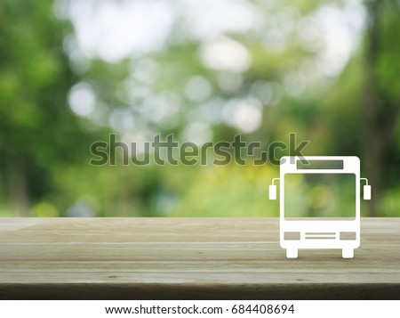 Bus flat icon on wooden table over blur green tree in park, Business transportation service concept