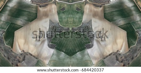 Child with two white miniature schnauzer,Abstract Symmetrical Photographs of Spain fields from the air ,artistic representation of human labor camps bird's eye view,  abstract  surreal, expressionist 