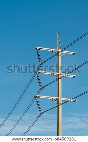 3 phases powerlines pose with blue sky background