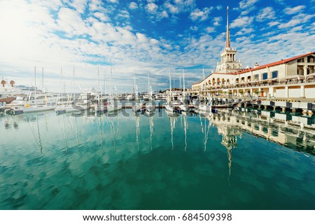 Yachts and boats anchored in the port of Sochi at sunset. Russia. Royalty-Free Stock Photo #684509398