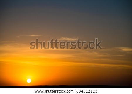 Sunset or sunrise over the Sahara Desert