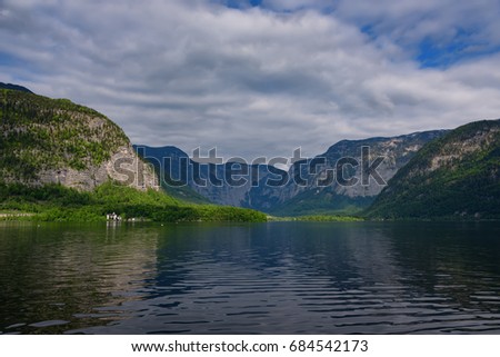 Scenic picture-postcard view of traditional old wooden houses in famous Hallstatt mountain village at Hallstattersee lake in the Austrian Alps in summer, region of Salzkammergut, Austria