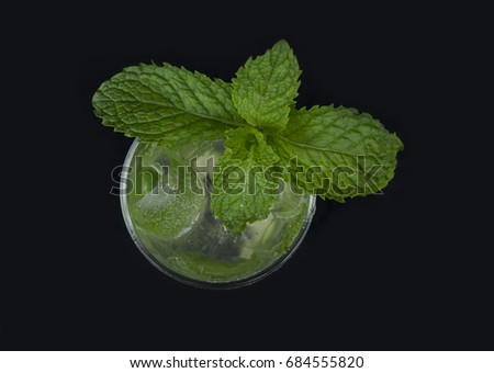 Mojito cocktail with lime and mint in highball glass on a grey stone background Copy space