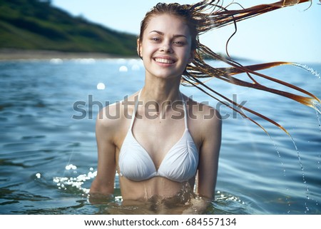 Happy woman in the sea, summer season                               