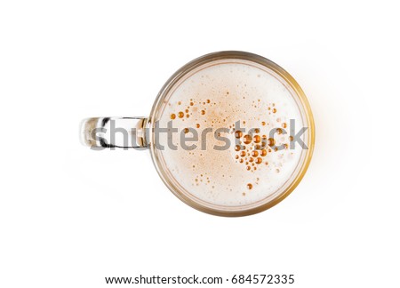 Mug of beer with bubble foam on glass isolated on white background top view