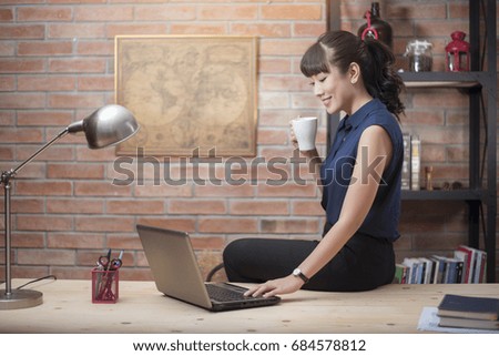 Beautiful woman is working in home office 