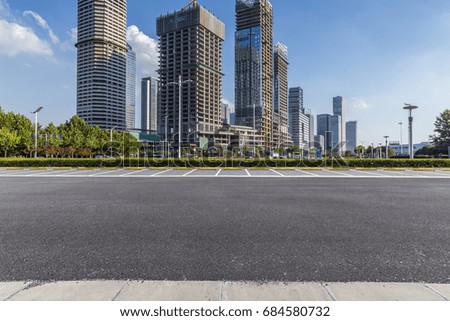 Empty urban road with modern business office building 
