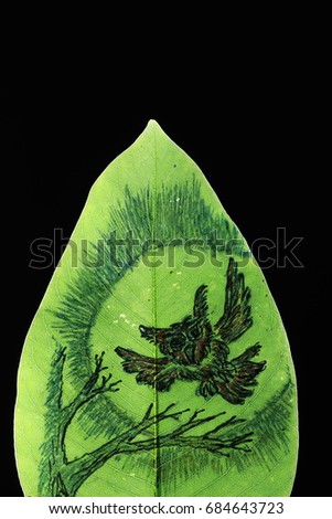 the red owl flying on moonlight painting on green leaf on black background