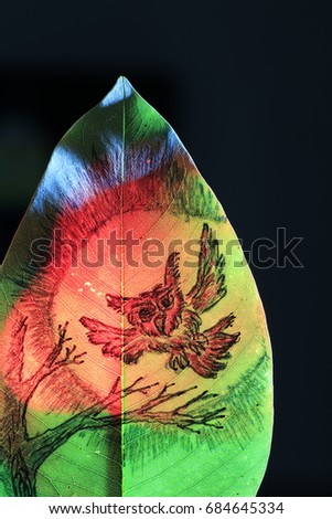 the red owl flying on moonlight painting on green leaf on red light on black background