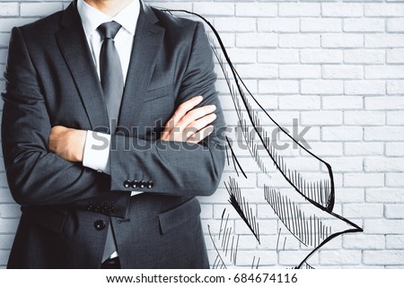 Businessman with drawn cape on brick wall background. Leadership concept  Royalty-Free Stock Photo #684674116
