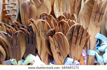 Kitchen utensils made of wood, spoons and forks background