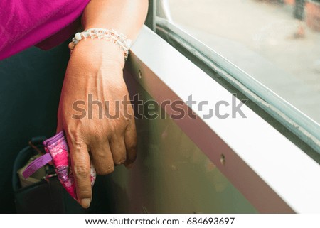 Woman hands on train window travel summer with copy space add text