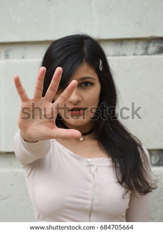 Young woman hand up stop