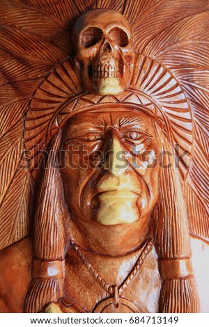 Apache, Red indian head Carved with wood,  closeup.