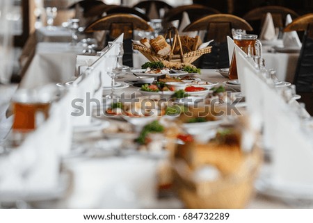 Photo of festive table with dishes and cutlery