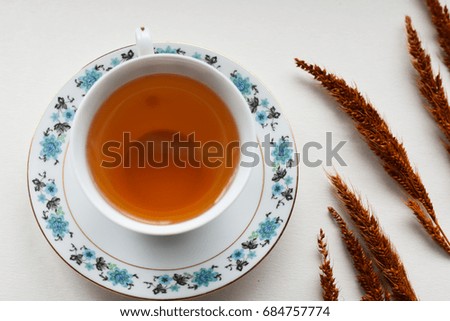 Tea with artificial flowers.