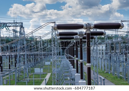 Electrical substation 330 kV, a series of high-voltage switches. Royalty-Free Stock Photo #684777187