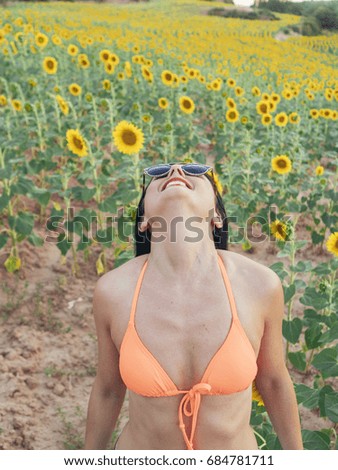 Beautiful Woman in a Sunflower Field