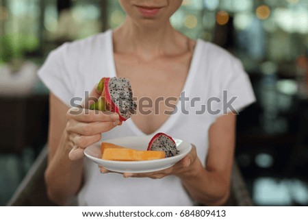 Happy smiling woman eating fruits close up. Healthy lifestyle, Balanced diet concept