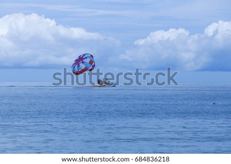 Parasailing is a popular pastime in many resorts around the world. The active form of relaxation. Focus on a parachute