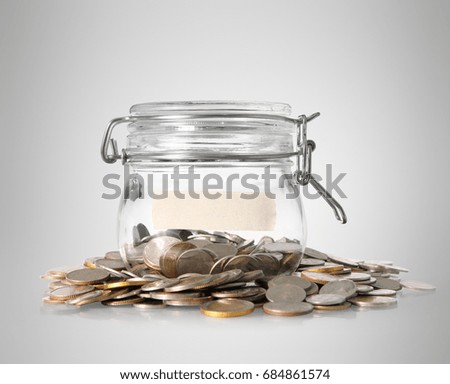 Silver coins in a piggy bank Glass