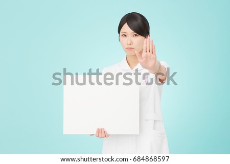 refusing Asian woman with the board