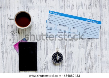 Buy tickets for travel. Tickets on light wooden table background top view copyspace