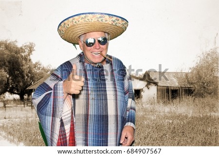 a man wears a sombrero and a serape while posing in a photo booth against a green screen or chroma key background  