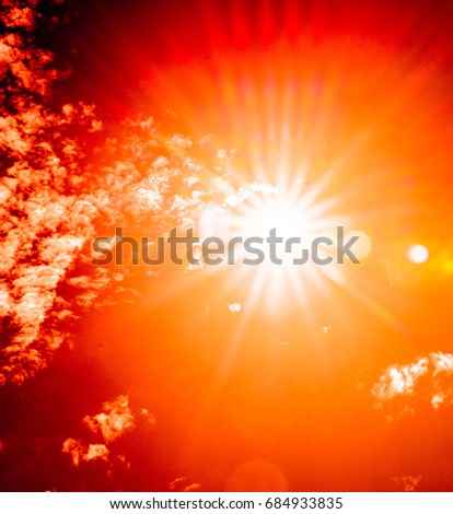 Abstract of orange sun with flare background, Beautiful rays of light.digital lens flare