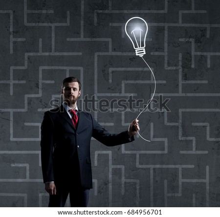 Businessman standing over labyrinth background. Business, strategy, concept.