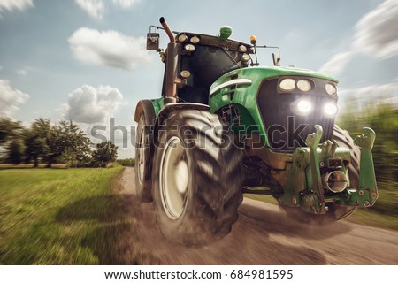 Tractor in full speed Royalty-Free Stock Photo #684981595