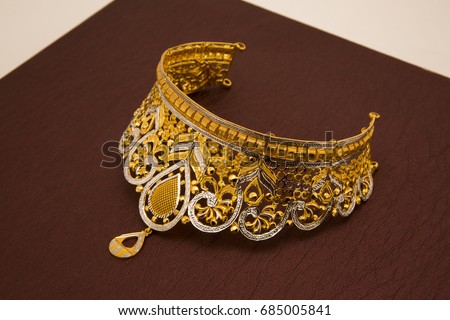 Ethnic Indian style, cut stones on gold base necklace   Royalty-Free Stock Photo #685005841