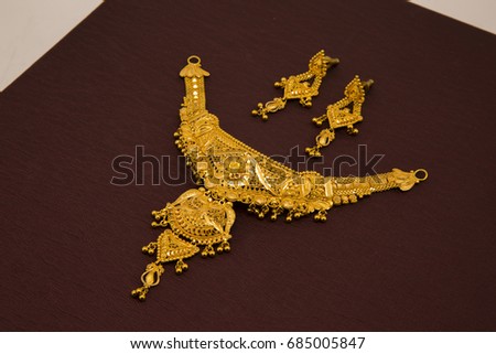 Bridal ethnic style embossed design gold necklace with earrings Royalty-Free Stock Photo #685005847