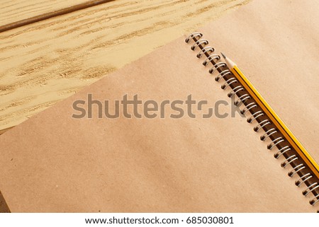 open notepad on wooden background