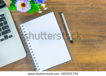 Modern office desk table top view with laptop, smartphone notebook and other supplies on wooden table background. Top view, flat lay. Concept for business, and Modern office. 