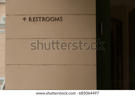 Direction to Bathroom Sign